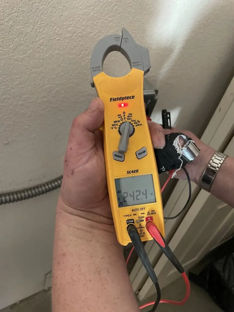 Voltage testing with clamp meter during Ceiling Fan Installation in Sunset
